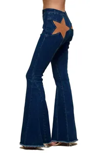 Side view of high-waisted flare jeans featuring a distinctive tan star patchwork design