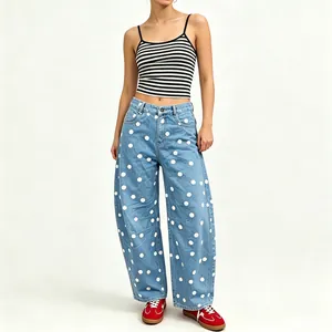 Full view of women's light blue polka dot wide leg barrel jeans with a relaxed fit.