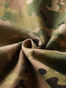 Close-up detail of durable camouflage twill fabric for men's rugged cargo pants