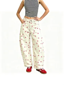 Stylish women's pink polka dot loose curved leg denim jeans with low waist design