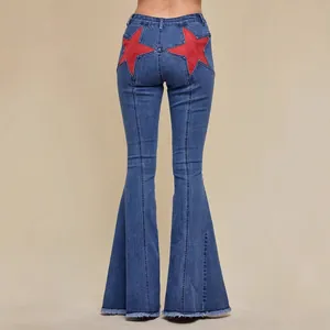 High-waisted blue stretch denim flare jeans featuring large red star patchwork on the back.