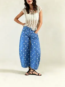 Stylish women's blue polka dot loose curved leg cropped jeans with a casual barrel fit