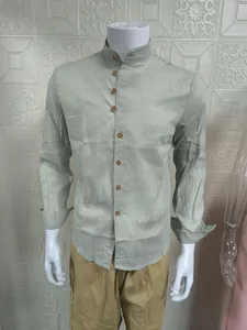 Detail view of men's sage green linen shirt with mandarin collar and buttons