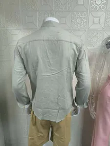 Back view of men's linen-style long sleeve shirt with stand collar in light green