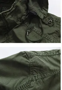 Close-up detail of army green hooded jacket showing stitching and fabric texture