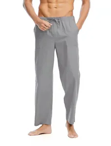 Dettaglio dei pantaloni da uomo in lino e cotone grigio con coulisse e tasche