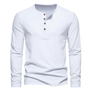 Detail view of men's white long sleeve Henley shirt featuring a four-button placket