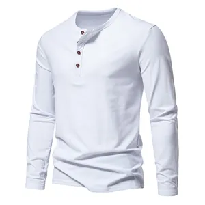 Close-up of white long-sleeved Henley shirt featuring four decorative brown buttons