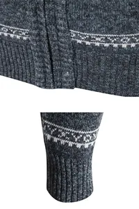 Detail macro view of men's knitted cardigan showing snowflake pattern and ribbed cuffs