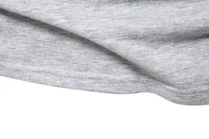 Close-up of double-needle hem stitching detail on a soft grey cotton jersey t-shirt