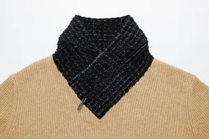 Close-up of camel men's knit sweater with black textured shawl collar and zipper detail.
