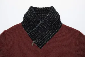 Close-up of men's burgundy knit sweater with black scarf collar and zipper detail.