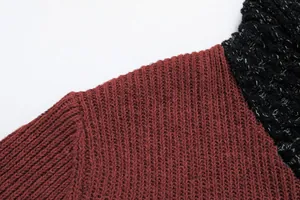Macro detail of men's slim fit patchwork sweater showing ribbed knit shoulder seam