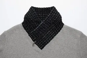 Close-up of men's grey knit sweater featuring a black marled scarf collar with zipper detail