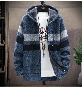 Detailed view of men's thick fleece-lined hooded sweater with color block knit texture.