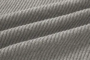 Close-up macro view of the grey ribbed knitted fabric texture for men's winter sweater