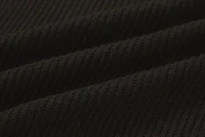 Close-up macro view of the dark brown ribbed knit fabric texture on a men's sweater