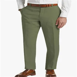 View of olive green linen fabric texture on men's trousers paired with a brown belt