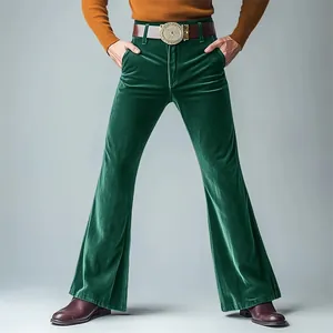 Detailed view of men's emerald green velvet flared trousers with a vintage style