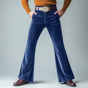 Detail shot of blue velvet flared dress pants with a stylish vintage wide-leg design.