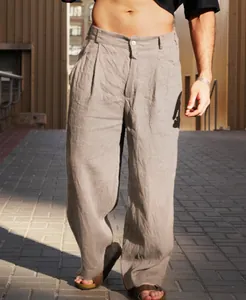 Detailed view of men's breathable khaki linen pleated wide-leg trousers for summer