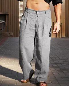 Detailed view of men's grey linen wide-leg trousers with breathable pleated texture