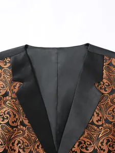 Macro detail of men's waistcoat showing orange paisley jacquard fabric and black satin lapels