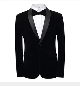 Detailed macro view of a men's black velvet tuxedo blazer with a satin shawl lapel