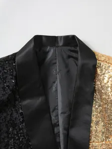 Detailed macro shot of a black and gold sequin tuxedo blazer showing the satin shawl lapel.