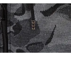 Detailed view of men's camouflage knit cardigan with zipper and drawstring texture