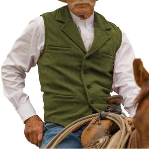 Men's green herringbone tweed vest styled in a rustic Western outdoor setting.