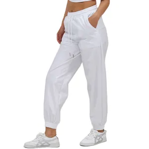 Women's stylish white high-waisted joggers featuring drawstring waist and elastic cuffs