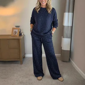 Women's starry night lounge set with crewneck top and drawstring wide-leg pants.
