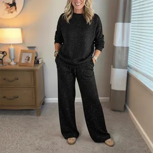 Sparkly black women's two-piece lounge set with long-sleeve top and drawstring pants