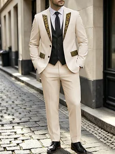 Detail of ivory tuxedo with gold floral print on lapels and pocket