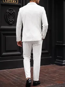 Back view of a white corduroy striped men's suit set against a black door.