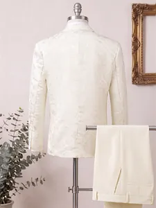 Detailed back view of premium men's cream suit featuring an intricate floral jacquard pattern