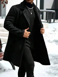 Detailed view of men's long wool coat with plush collar in snowy outdoor setting