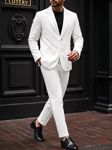 Full body detail of men's white vertical striped business suit with black shoes