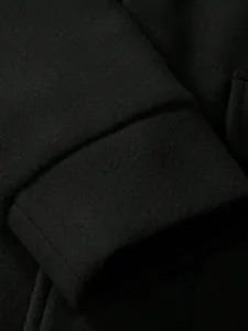 Macro view showing the high-quality black woolen fabric texture of male casual winter jacket