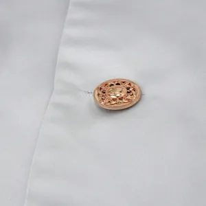 Macro detail of a rose gold vintage button on a silver men's business suit blazer