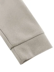 Detailed close-up showing the high-quality wool fabric texture of a men's gray jacket