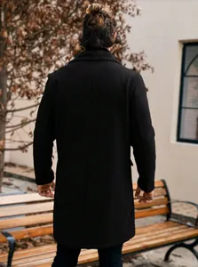 Back view of men's long black woolen overcoat with a plush collar
