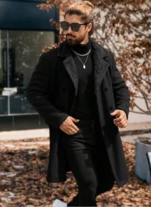 Detail view of a men's black long woolen coat with a plush shearling collar