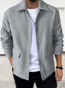 Close-up of grey men's casual woolen jacket with flap pockets and lapel collar