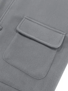 Detail view of a grey woolen jacket showing the flap pocket and soft fabric texture