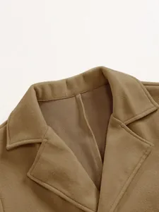 Close-up detail of the tailored notch lapel on a premium tan wool coat for men