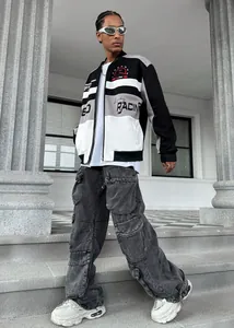 Street style detail of men's racing jacket with cargo pants and chunky sneakers