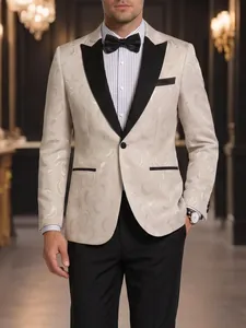 Detail of elegant men's jacquard tuxedo with black peak lapels for formal events