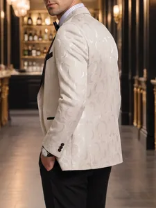 Detailed side view of beige jacquard blazer with elegant swirl patterns and black lapel